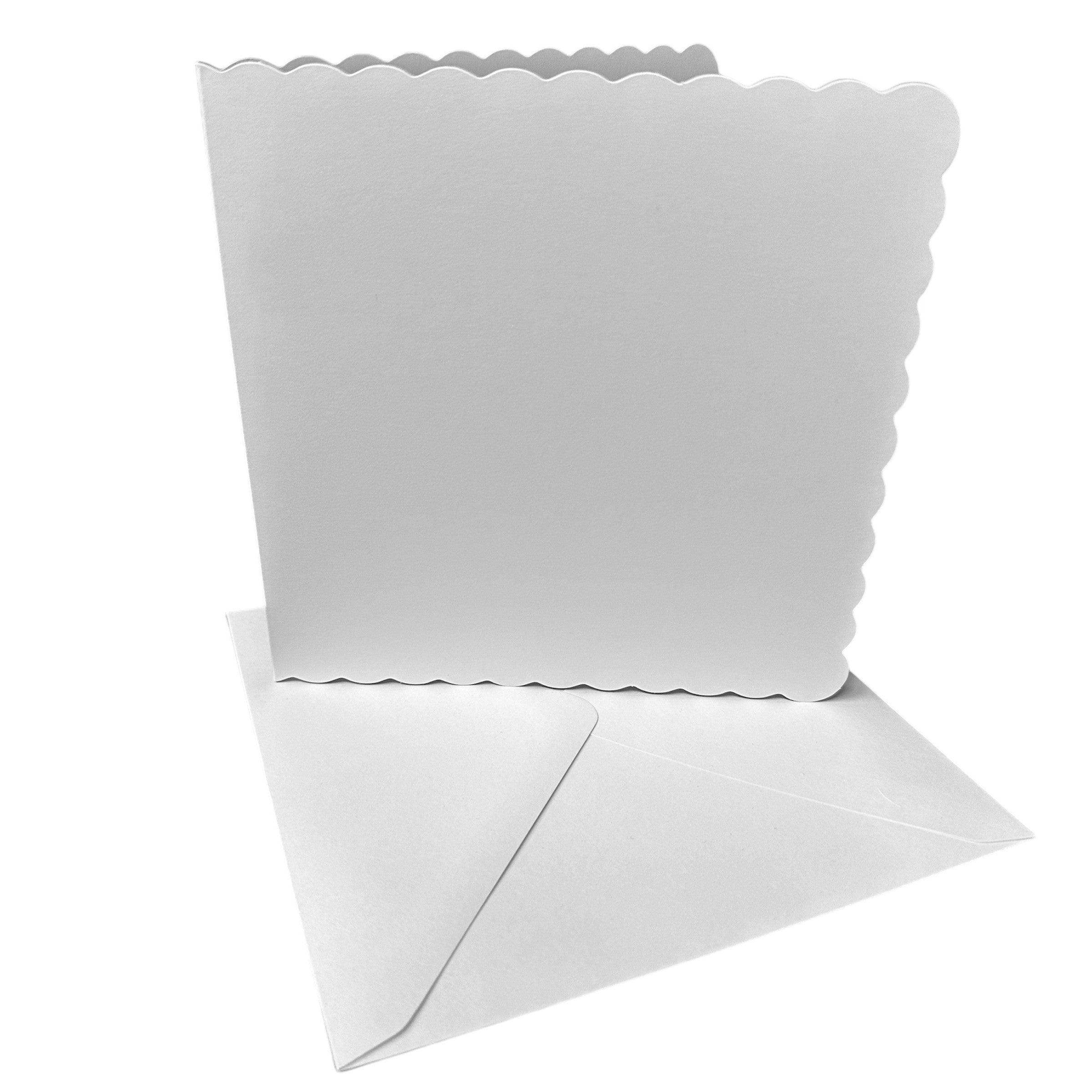 Scalloped edge card blanks with coordinating envelopes arranged neatly, ready for handmade greeting cards and invitations.